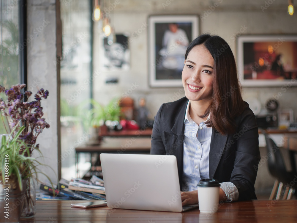 Asian business woman with laptop happy and smile concept success work Asian business woman with laptop happy and smile concept success work