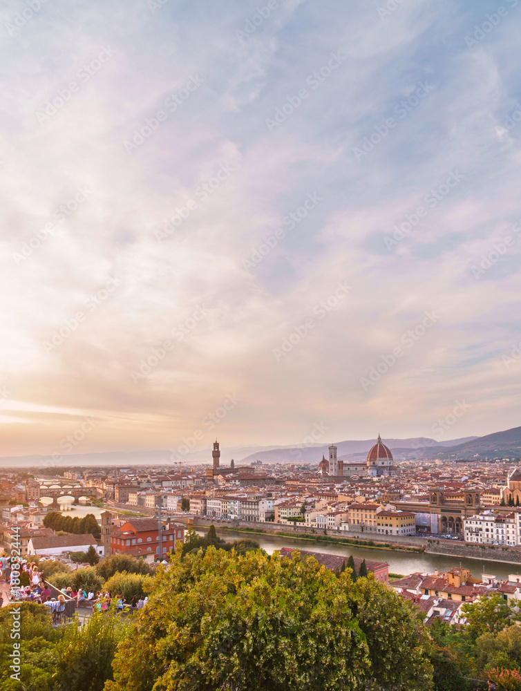 Florence cityscape with Ponte Vecchio bridge, Santa Maria del Fiore cathedral and spectacular sunset sky.