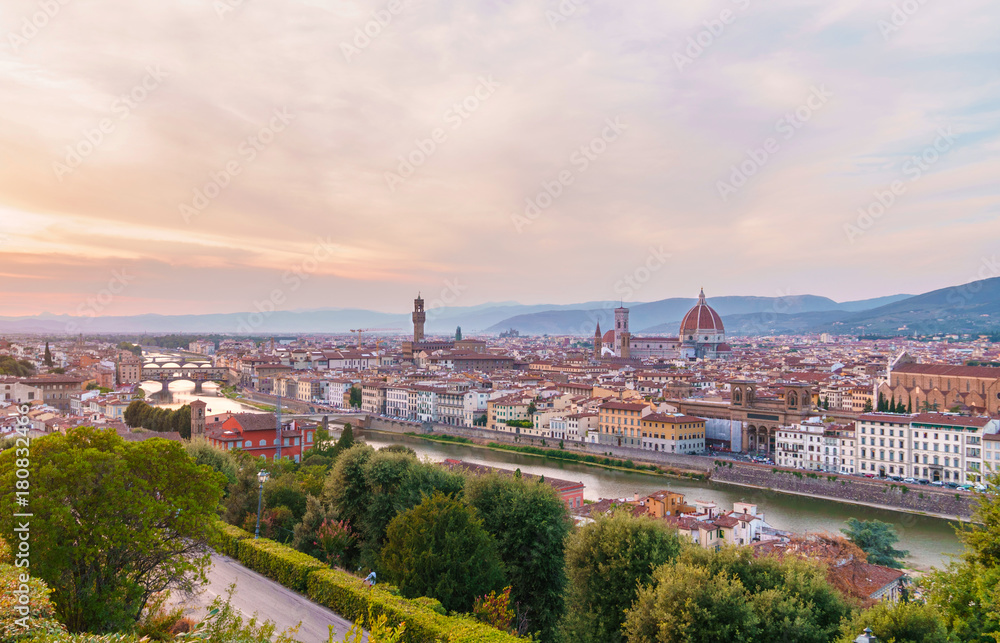 Florence cityscape with Arno river, Ponte Vecchio bridge and Santa Maria del Fiore cathedral at sunset time.