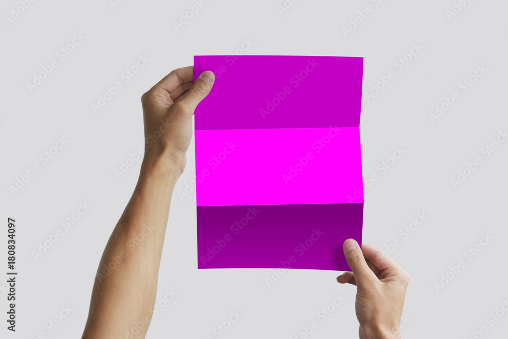 Hand holding blank brochure booklet in the hand. Leaflet presentation. Pamphlet hand man. Man show offset paper. Sheet template. Book in hands. Booklet folding design. Fold paper sheet display read Hand holding blank brochure booklet in the hand. Leaflet presentation. Pamphlet hand man. Man show offset paper. Sheet template. Book in hands. Booklet folding design. Fold paper sheet display read