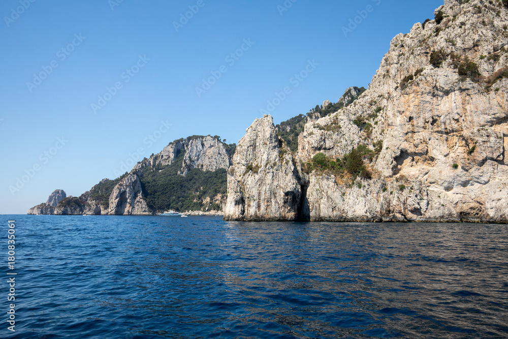 View from the boat on the cliff coast of Capri Island