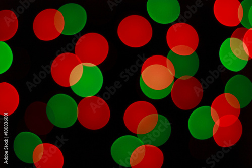 Red and green bokeh lights of Christmas garland. Blurred background.