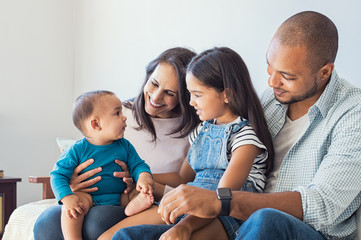 Family playing with baby