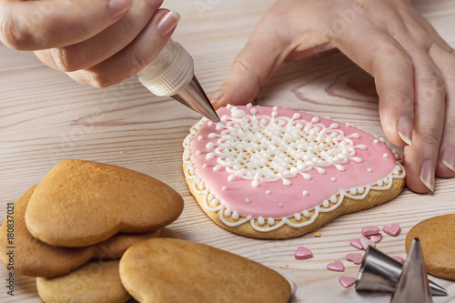 Decoration cream with cookies in shape of heart.