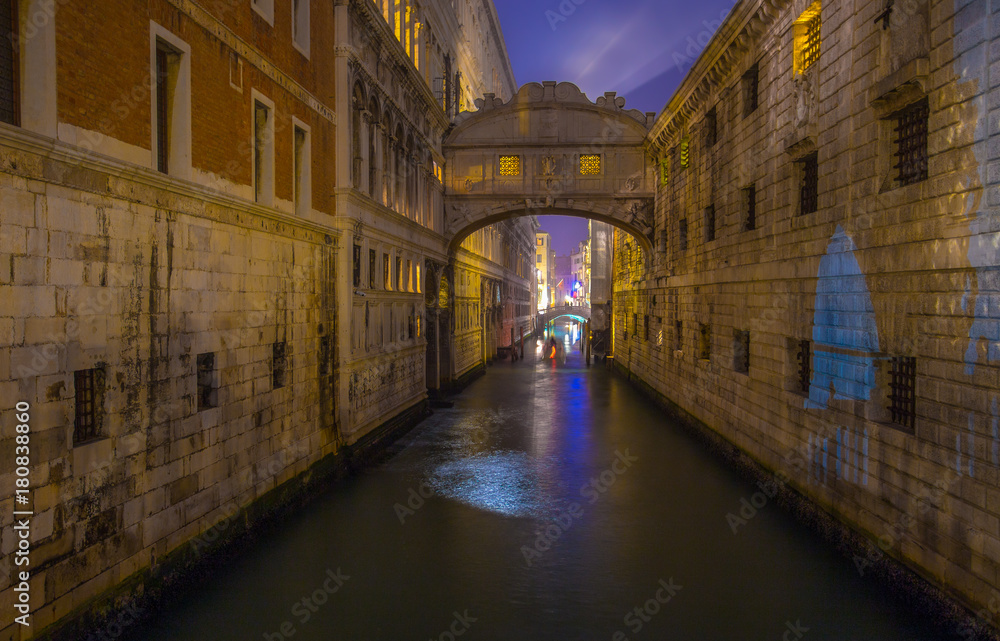 View of the Bridge of Sighs (Ponte dei Sospiri) by night, Venice, (Venezia), Italy.