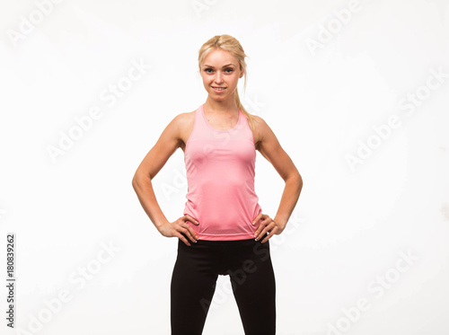Young confident woman portrait of a businesswoman showing by hands on a gray background. Ideal for banners, registration forms, presentation, landings, presenting concept
