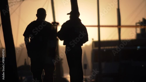 Sillhoutte cops secure crime scene, slo-mo.