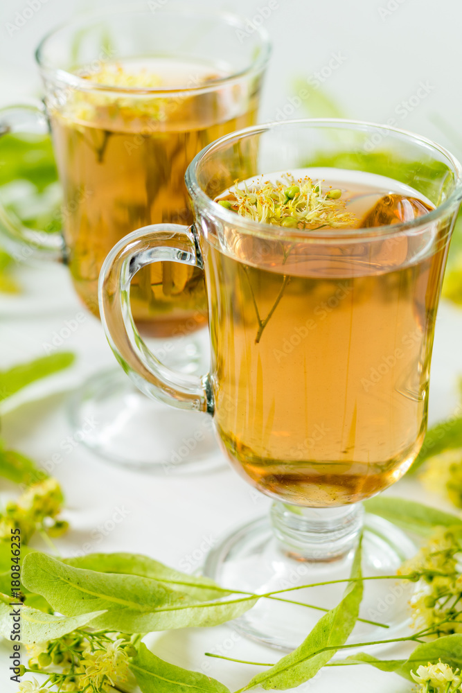 Linden herbal tea in transparent grog glass Linden herbal tea in transparent grog glass