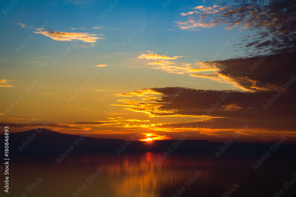 Orange coloured sunset on Trasimeno Lake in Italy