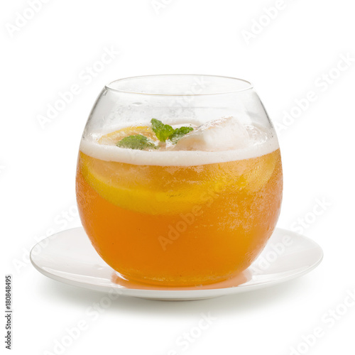 Refreshing glass of iced tea with lemon, mint isolated on white backgroun