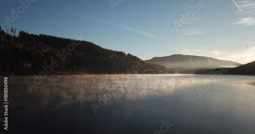 Erlaufsee mit aufsteigendem Dampf im Herbst mit Mariazeller Bürgeralpe im Hintergrund photo