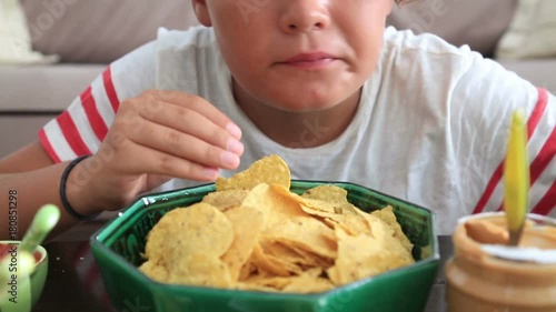 Young boy eating unhealthy eating
