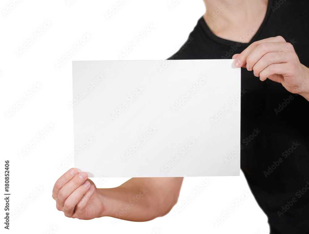 Man in black t shirt holding blank white A4 paper. Leaflet presentation. Pamphlet hold hands. Man show clear offset paper. Sheet template. Isolated on white background. Man in black t shirt holding blank white A4 paper. Leaflet presentation. Pamphlet hold hands. Man show clear offset paper. Sheet template. Isolated on white background.