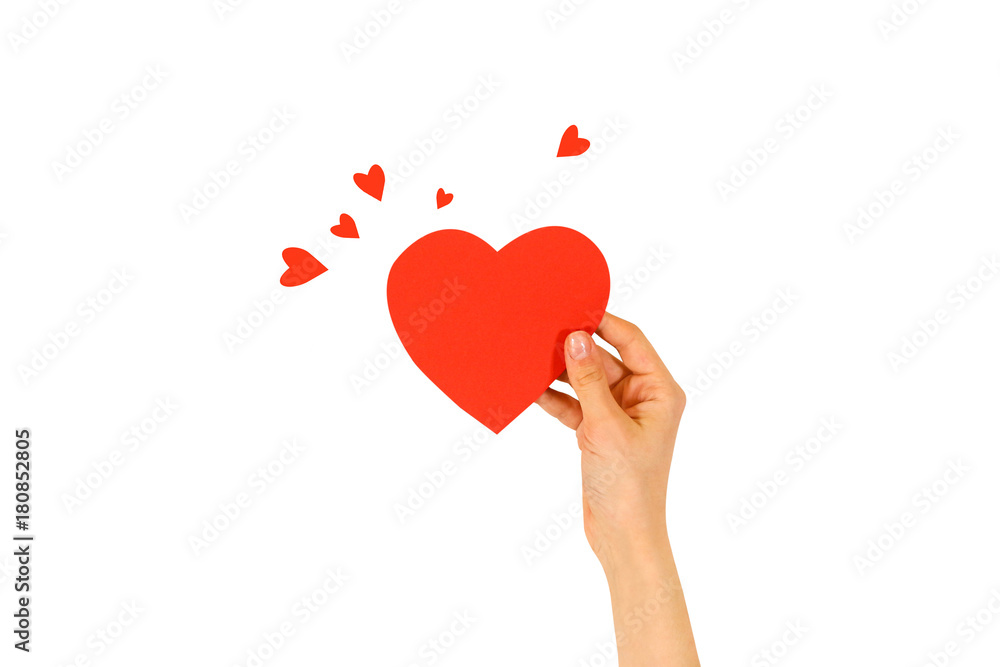Female hand holding empty red Valentines card with heart on a white background Female hand holding empty red Valentines card with heart on a white background