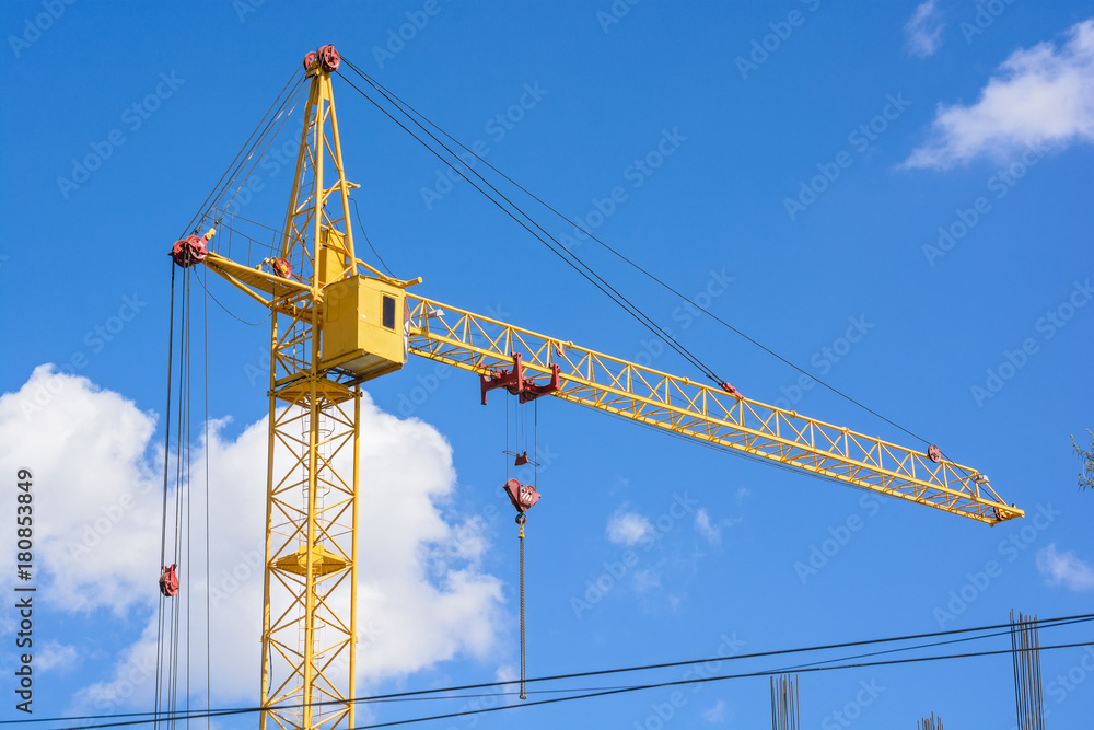Construction crane builds new building Construction crane builds new building