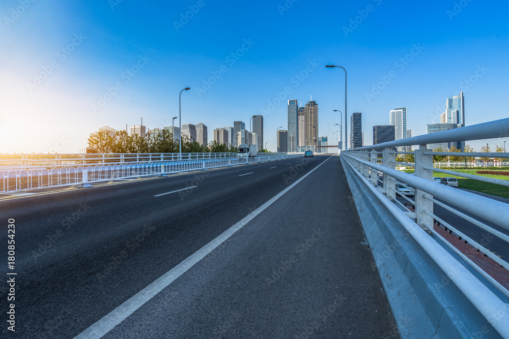 clean urban road and modern skyline background clean urban road and modern skyline background