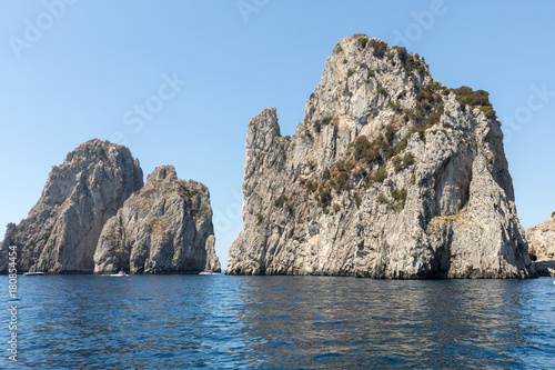 View from the boat on the Faraglioni Rocks on Capri Island, Italy.