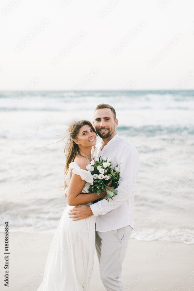 A loving couple is walking on the beach A loving couple is walking on the beach
