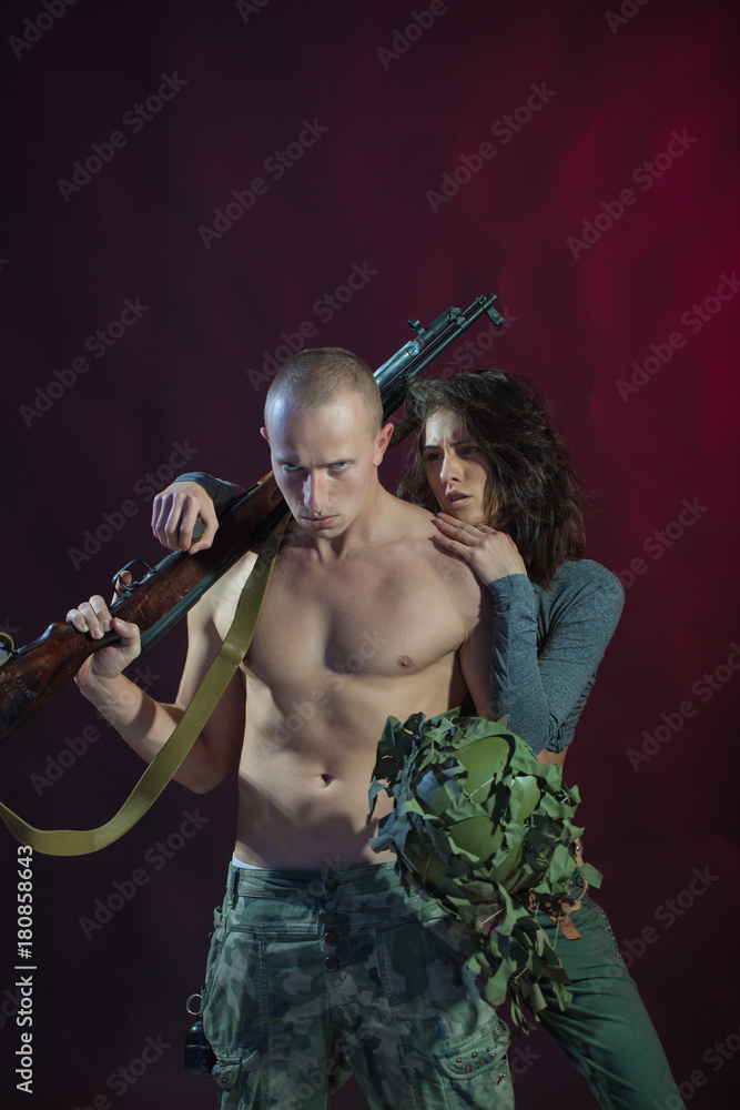 Military, war, conflict, soldiers. Xxx. Porn. Sexy couple. Sensual.  Sensuality. Man and woman posing. Soldier. Stock Photo | Adobe Stock