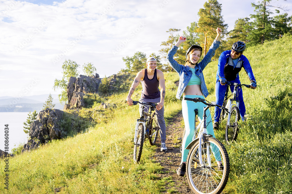 Fototapeta premium People travelling on a bicycle