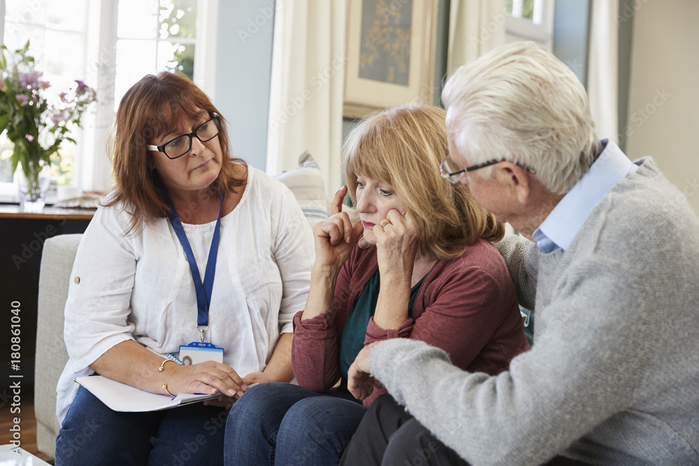 Support Worker Visits Senior Woman Suffering With Depression Support Worker Visits Senior Woman Suffering With Depression