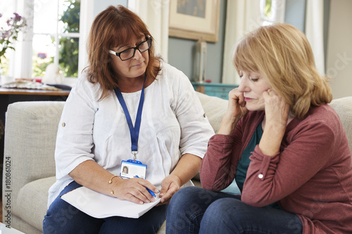 Support Worker Visits Senior Woman Suffering With Depression photo