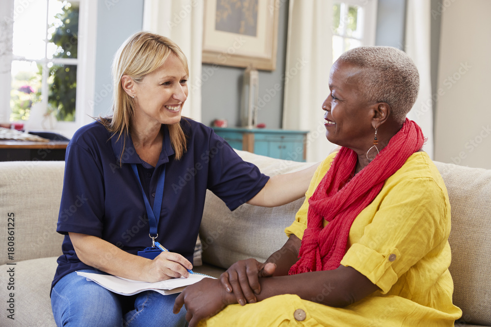 Female Support Worker Visits Senior Woman At Home Stock Photo Adobe Stock