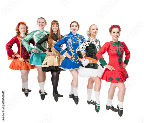 Group of beautiful women in dresses for Irish dance isolated photo