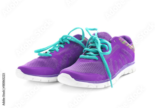 Pair of violet tennis shoes, isolated on white
