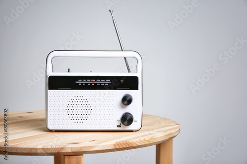 Retro radio on table photo