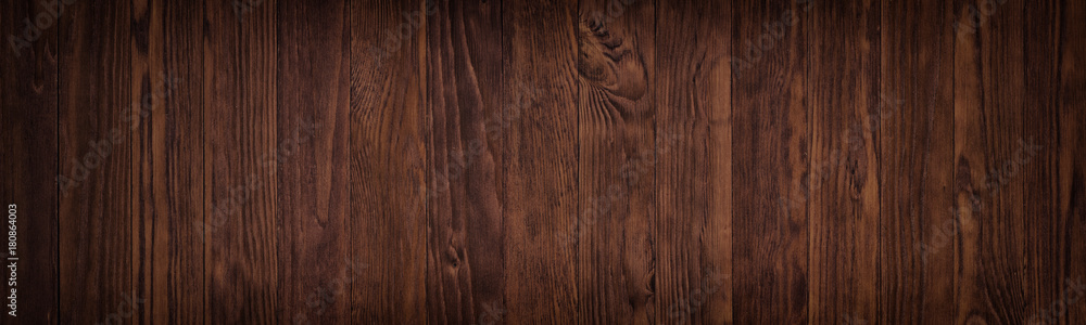 Fototapeta premium Dark wooden surface of a table or floor surface, gloomy wood texture