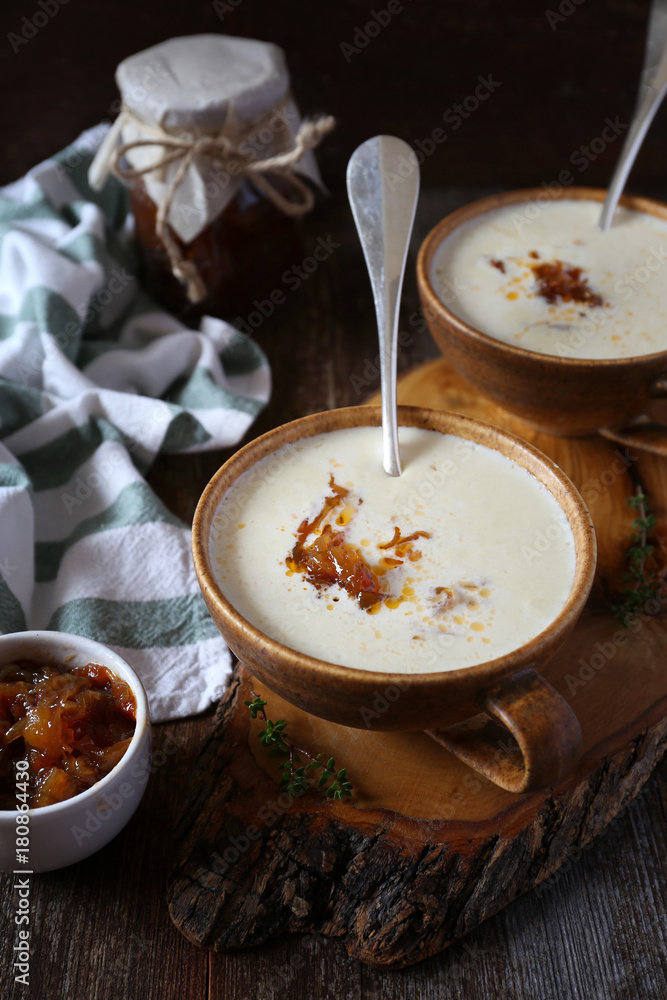 Two portions of onion cream soup with caramelized onions, rustic style Two portions of onion cream soup with caramelized onions, rustic style