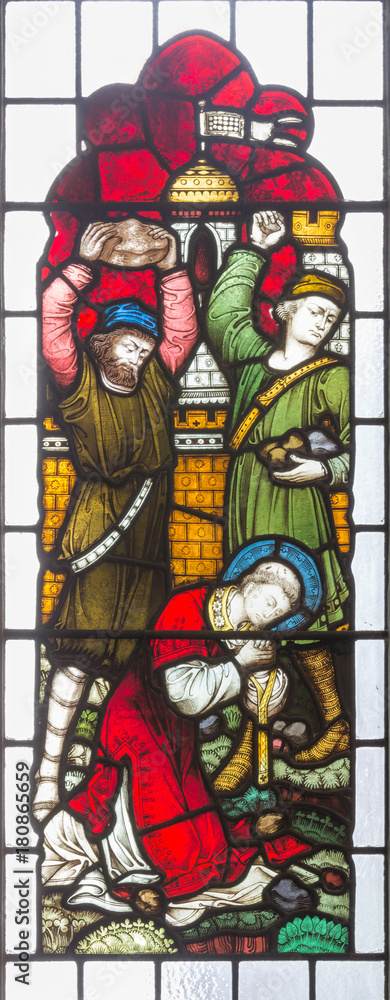 LONDON, GREAT BRITAIN - SEPTEMBER 19, 2017: The Stoning of St. Stephen on Stained glass in St Mary Abbot's church on Kensington High Street.