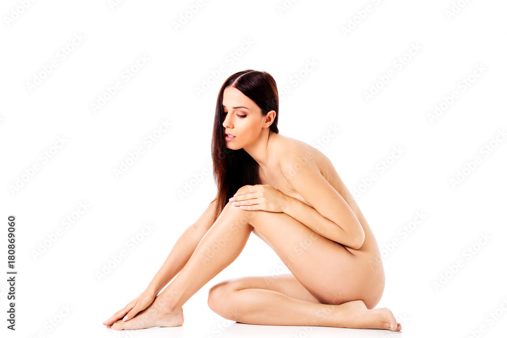 Fototapeta premium Young nude woman sitting on the floor