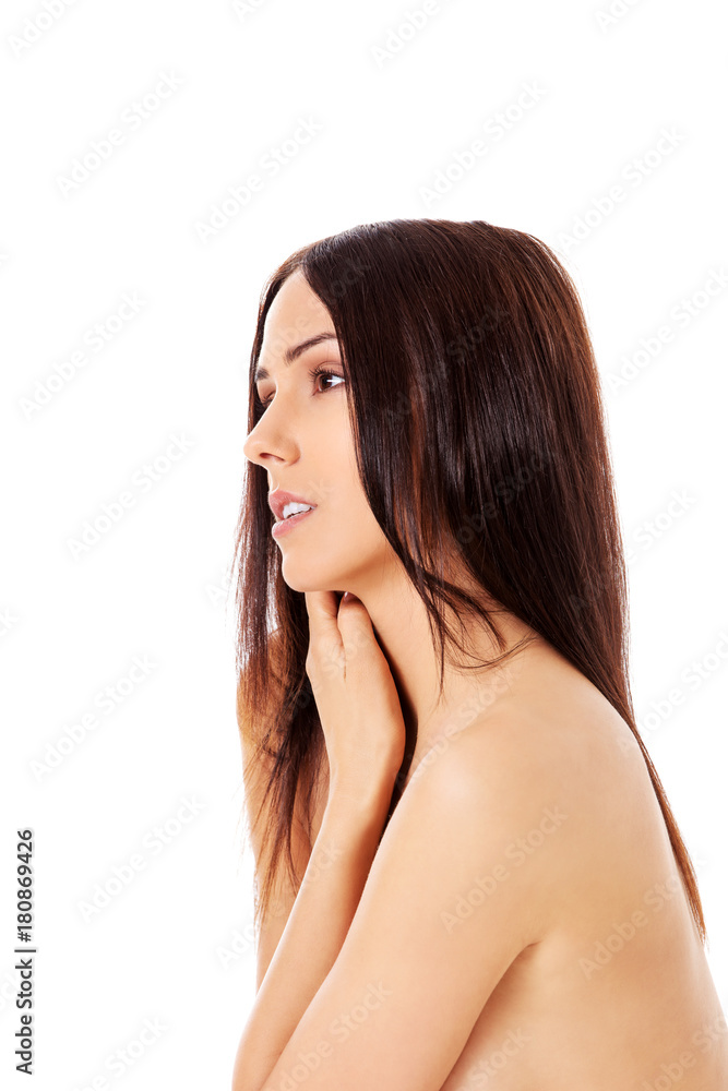 Fototapeta premium Young nude woman sitting on the floor