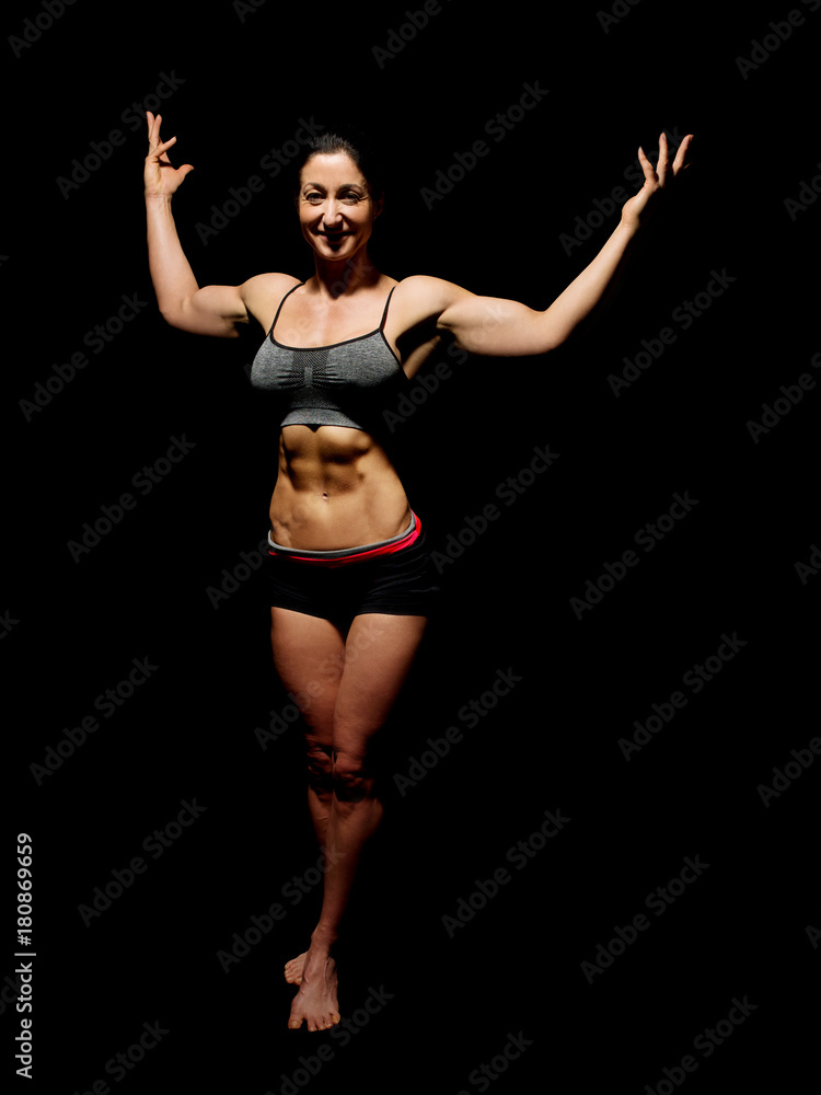 Muscular bodybuilder woman showing her muscles. Muscular bodybuilder woman showing her muscles.