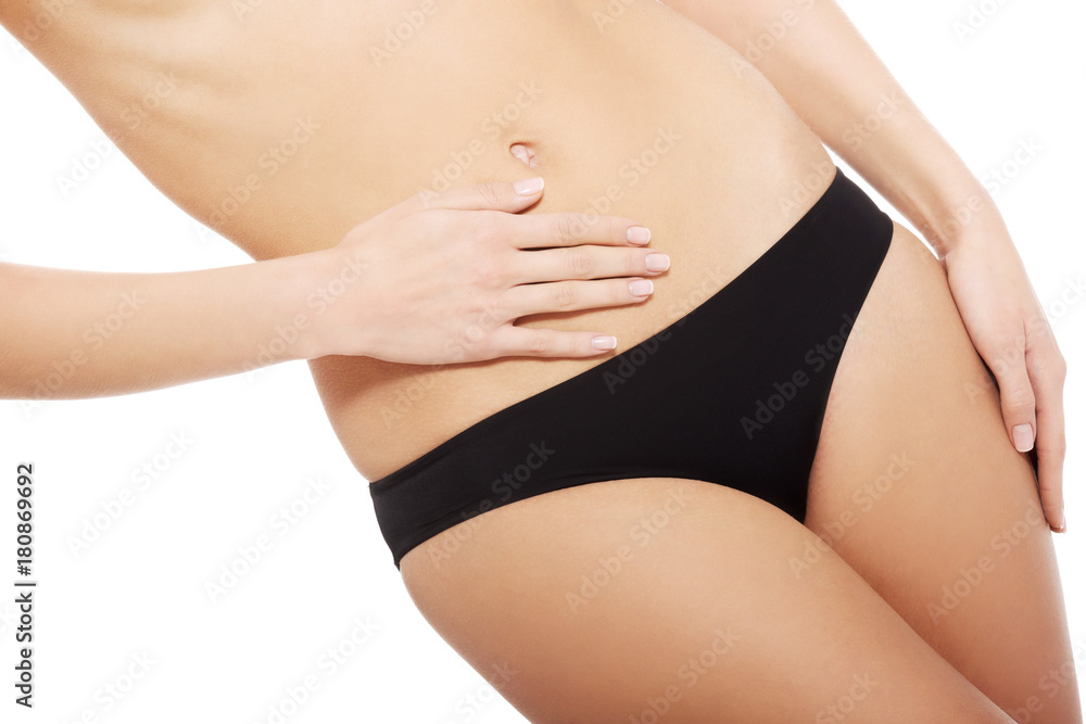 Caucasian woman is holding hand on her belly. Caucasian woman is holding hand on her belly.