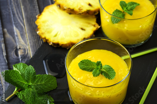 Homemade mango and pineapple smoothie made with coonut milk. photo