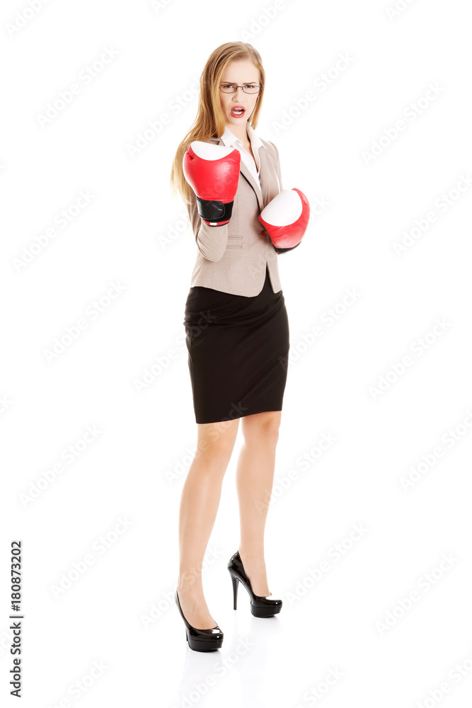 Beautiful caucasian business woman with boxing gloves. Beautiful caucasian business woman with boxing gloves.