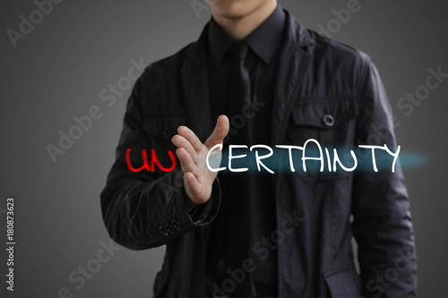 The concept of certainty. Businessman making certainty from uncertainty