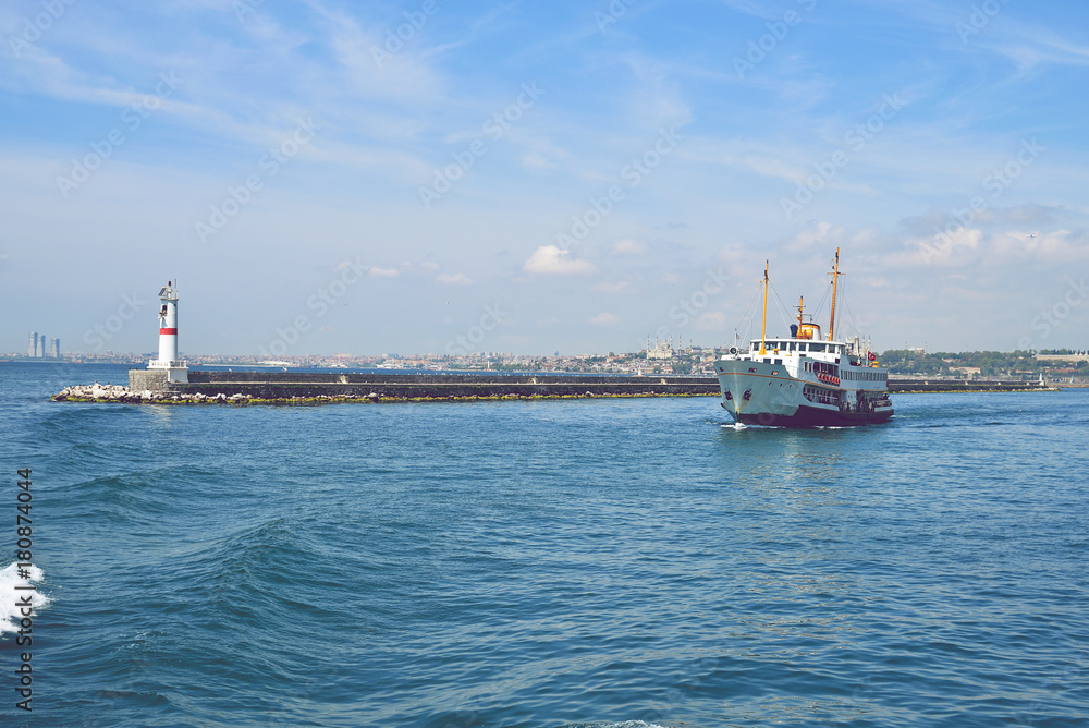 The ship carries passengers along the Bosporus Strait.
