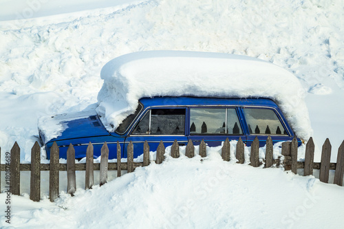 blue car under the snow 