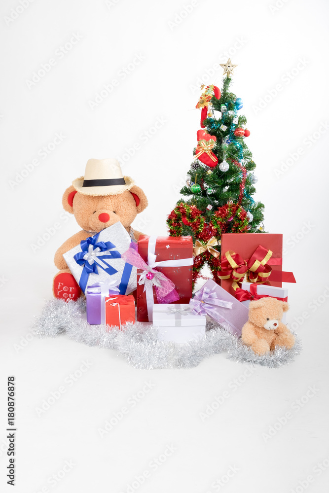 Bear doll with boxs gifts and christmas tree on white background in christmas festival Bear doll with boxs gifts and christmas tree on white background in christmas festival