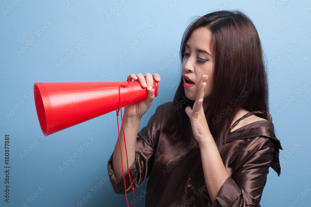 Beautiful young Asian woman announce with megaphone. Beautiful young Asian woman announce with megaphone.