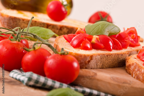 Bruschetta bread with basil and chopped tomatoes. 