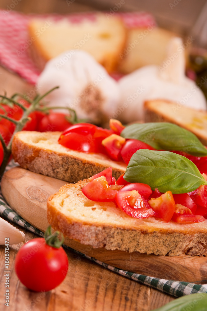 Bruschetta bread with basil and chopped tomatoes. 