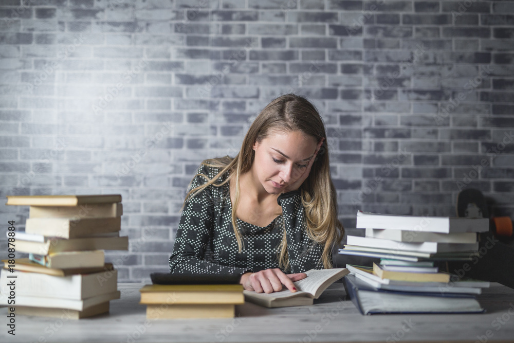 Young woman reading and studying at home Young woman reading and studying at home