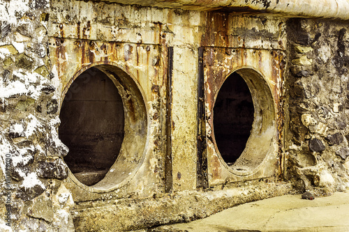 Rust and corrosion in the pipe and metal skin.Corrosion of metal.Rust of metals. Drainage Pipe Water pollution in river because industrial effluent not treat water before drain.