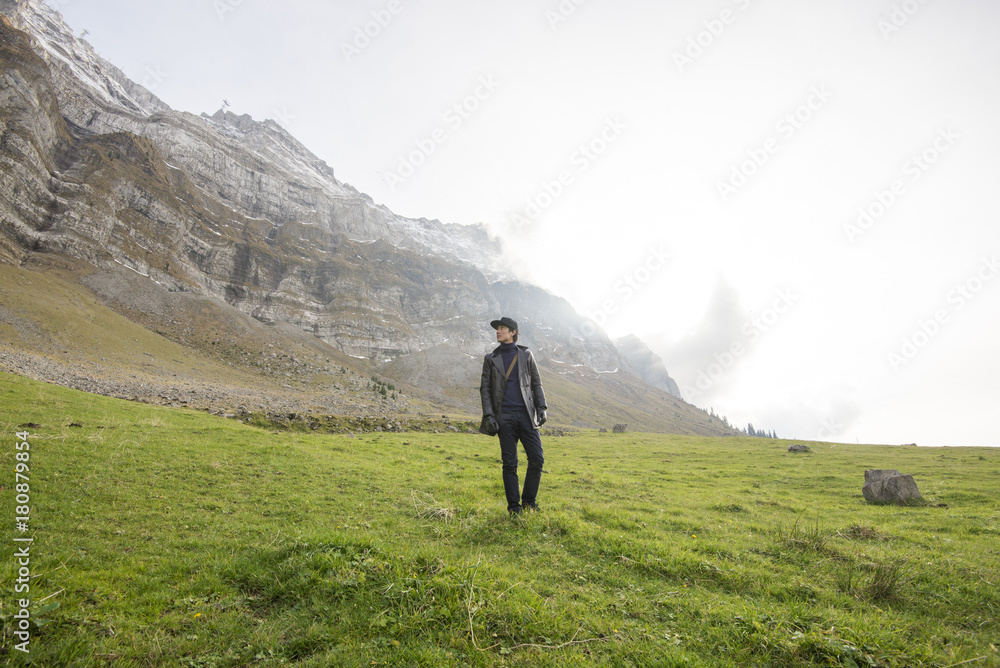 Tourist man and Beautiful view of valley mountain Saentis , Switzerland Tourist man and Beautiful view of valley mountain Saentis , Switzerland