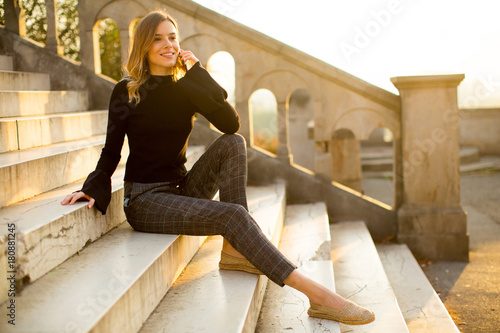 Young woman holding mobile ...